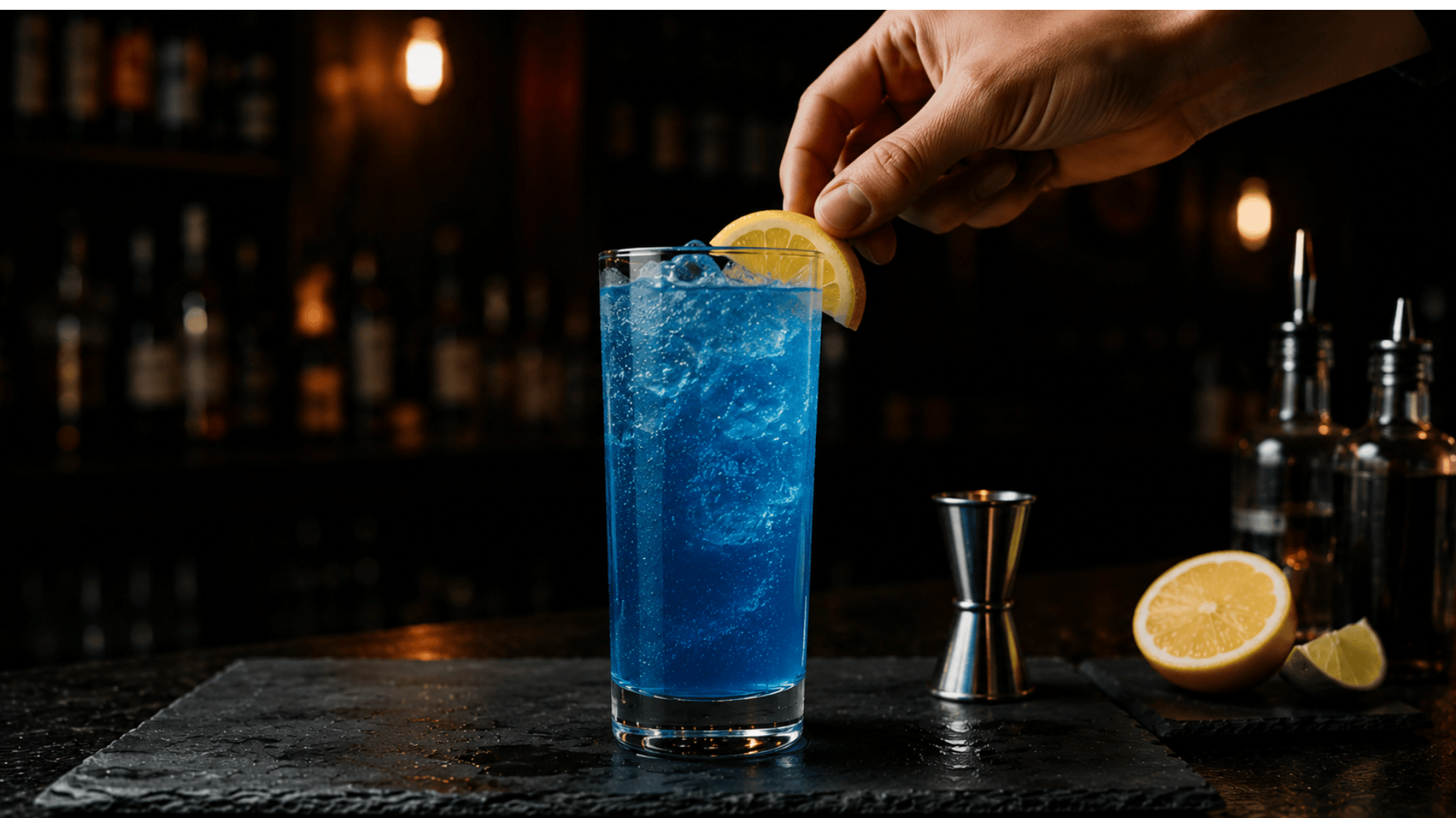 Finished AMF cocktail in a tall clear highball glass with bright blue fizzy liquid