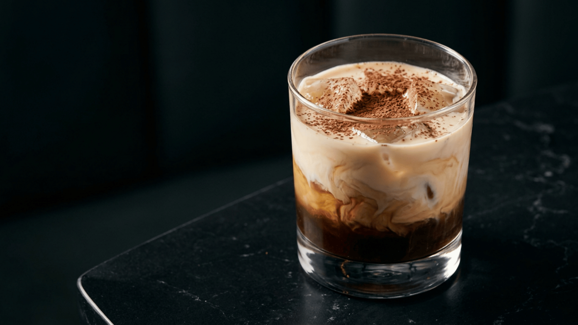 Creamy mudslide cocktail in a rocks glass with coffee, chocolate, and cream tones.