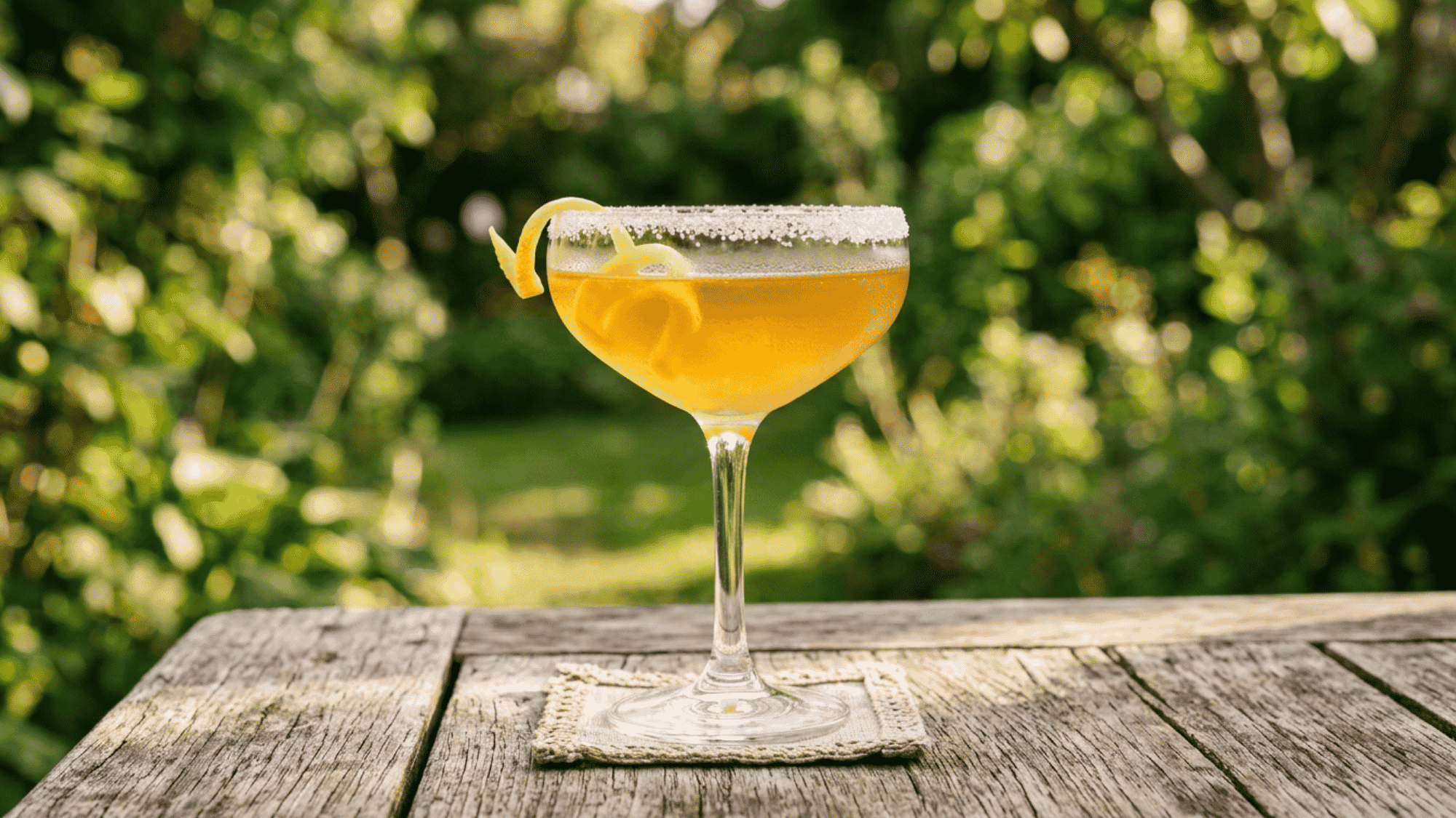 Sidecar with sugar rim and lemon twist in a coupe glass