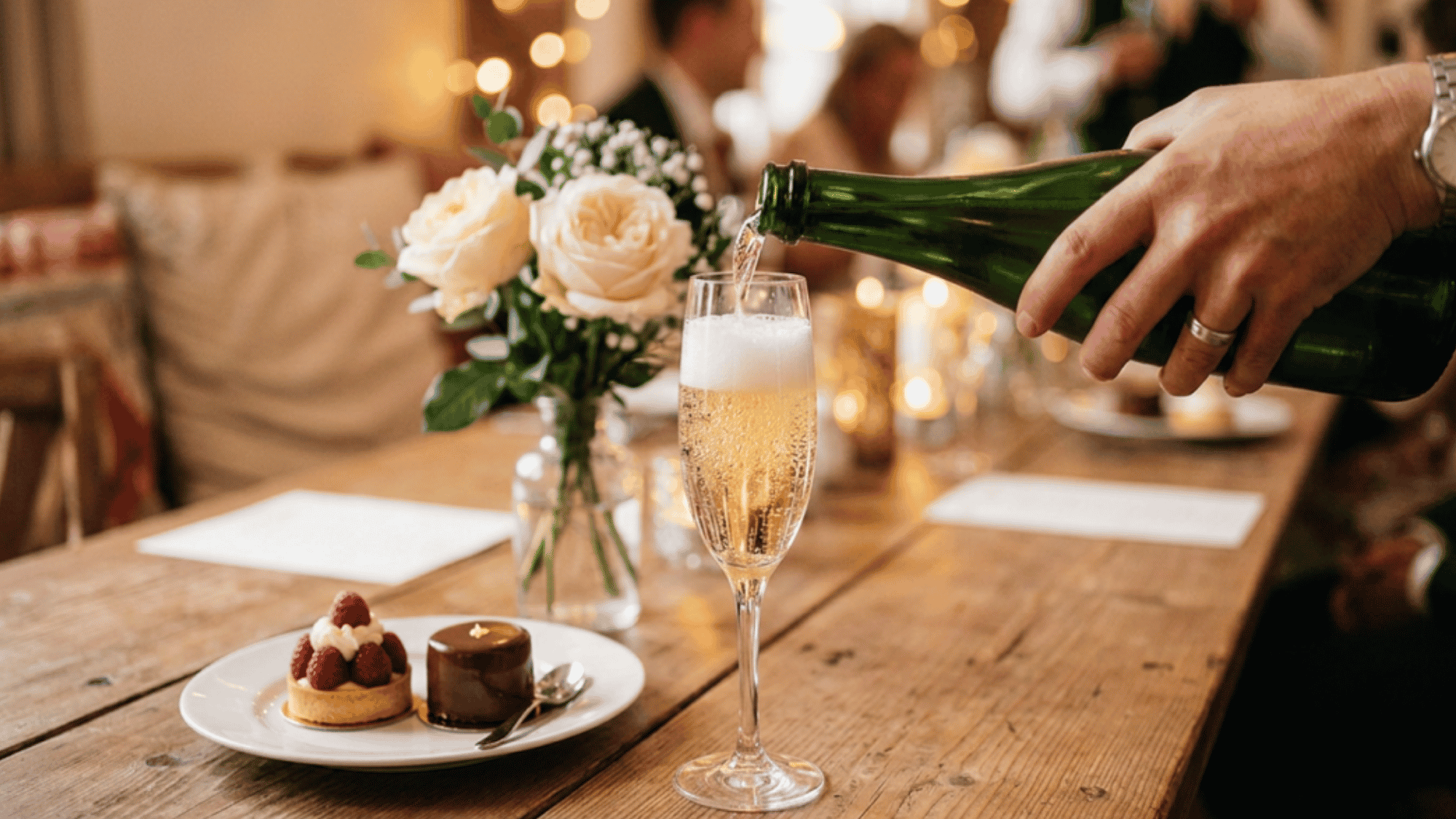 A glass of sparkling wine with fine bubbles rising to the top.