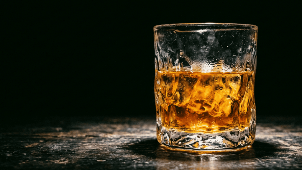 Single neat spirit poured in glass at room temperature.