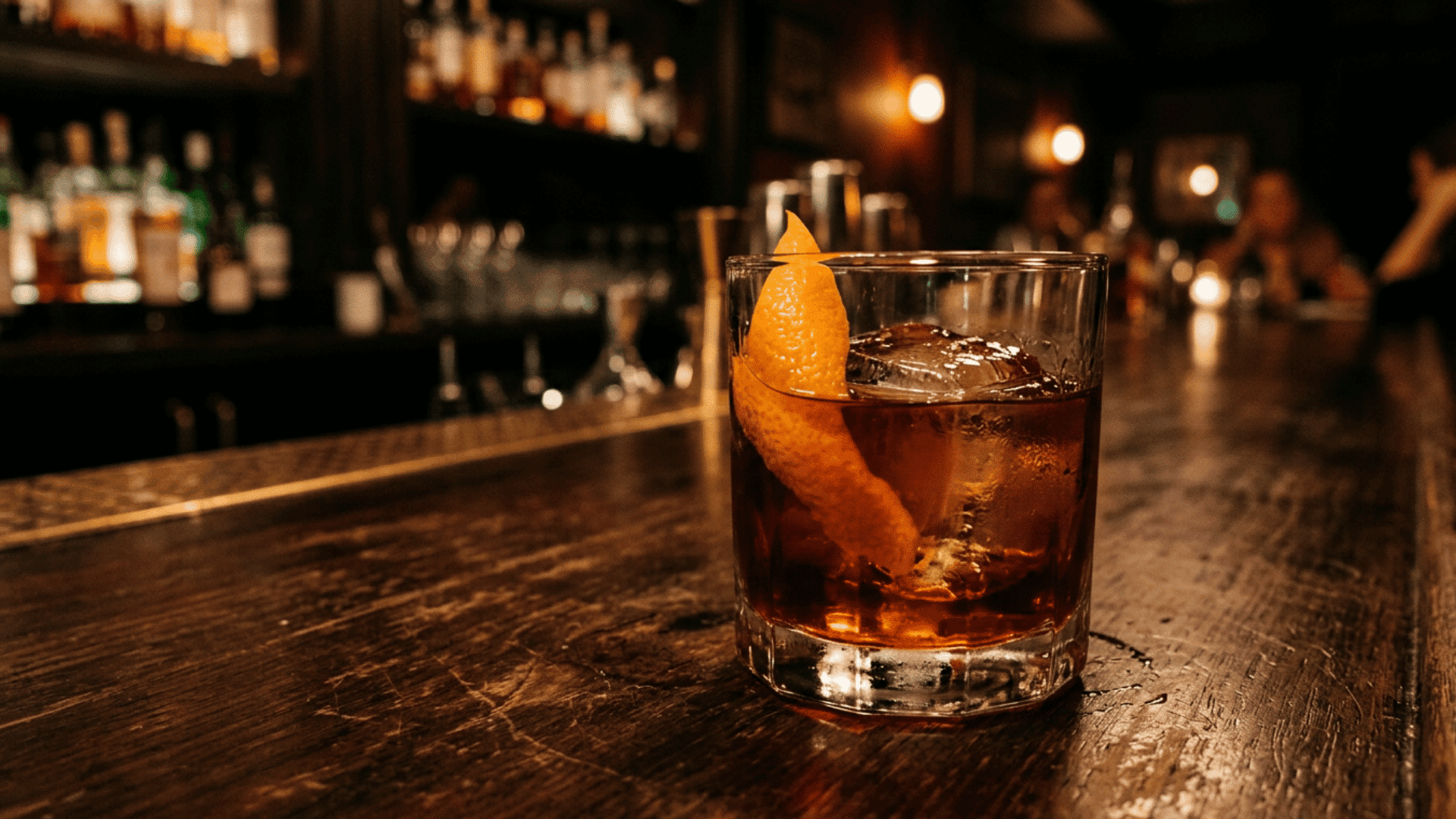 Boulevardier with orange peel on dark bar