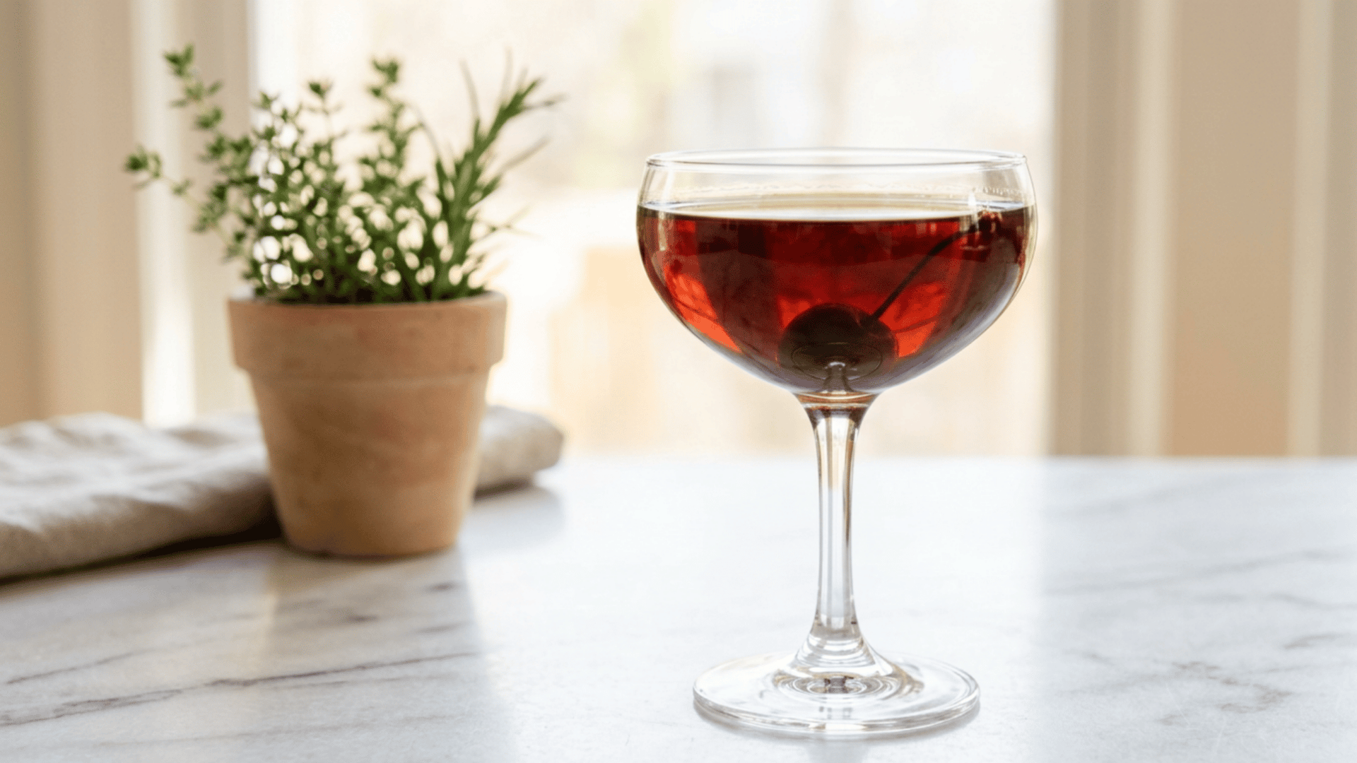Coffee and Cherry Rye Cocktail with a brandied cherry garnish