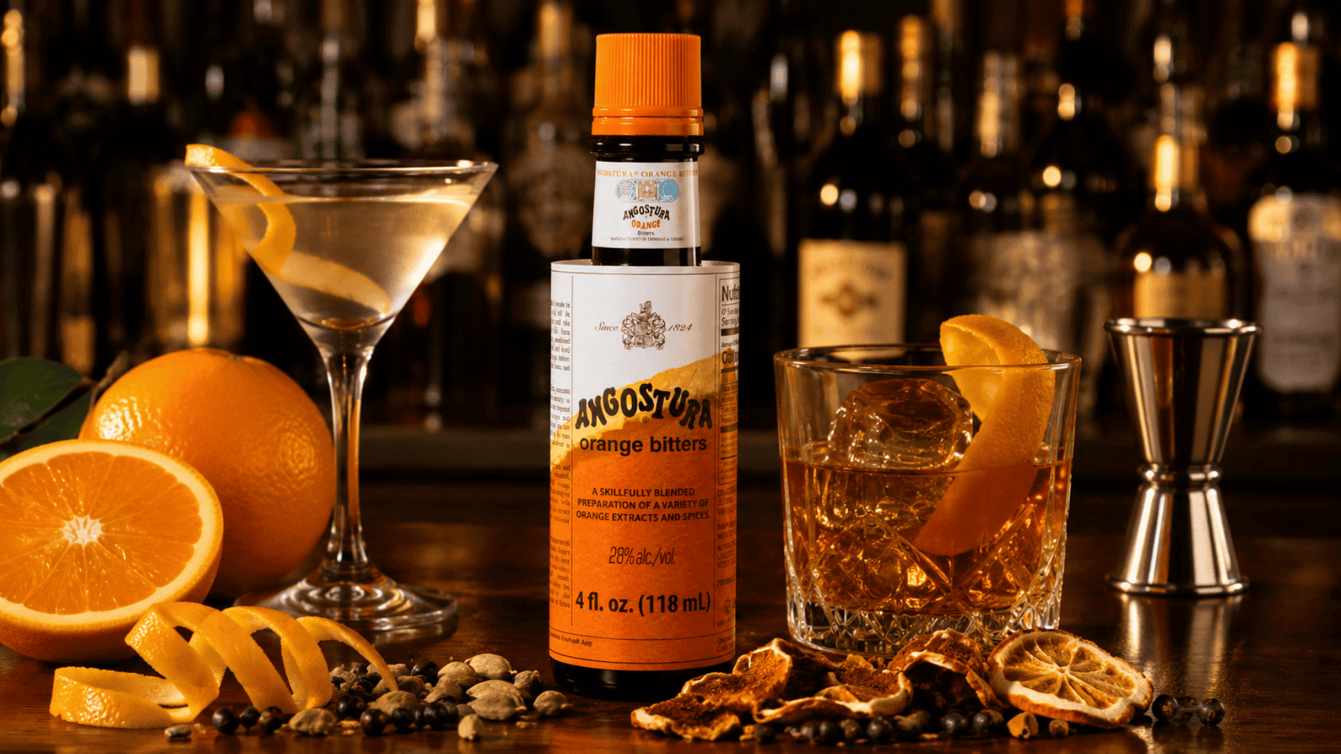 orange bitters with fresh citrus peels, gin and whiskey cocktails, and bright botanicals on a polished wooden bar
