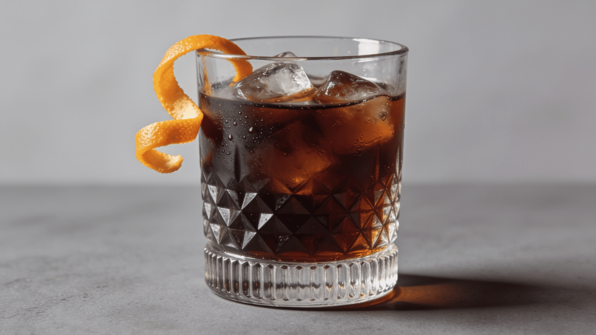 Vieux Carré cocktail with cherry over ice