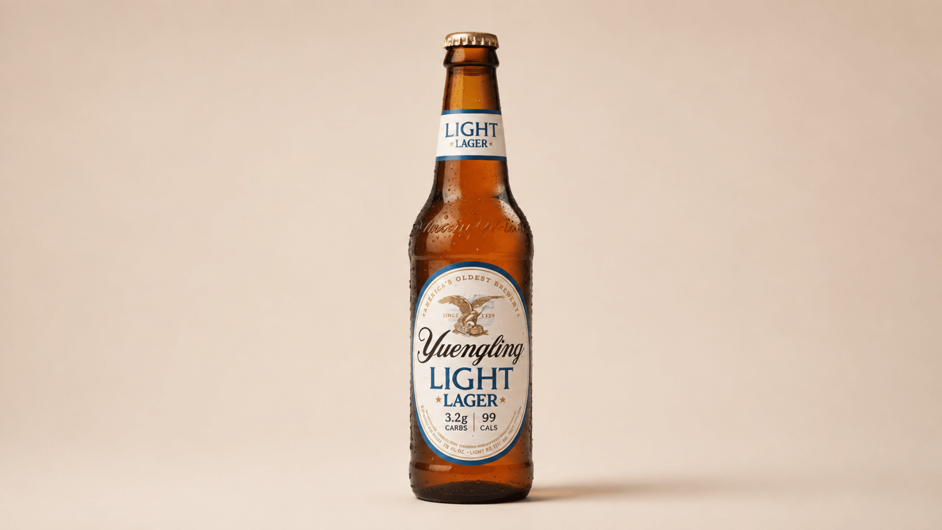 yuengling light lager bottle with label on plain background.