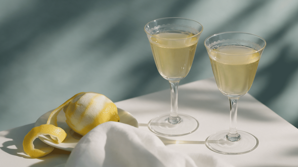 aperitif and digestif drinks served with snacks and dessert on a dark restaurant table