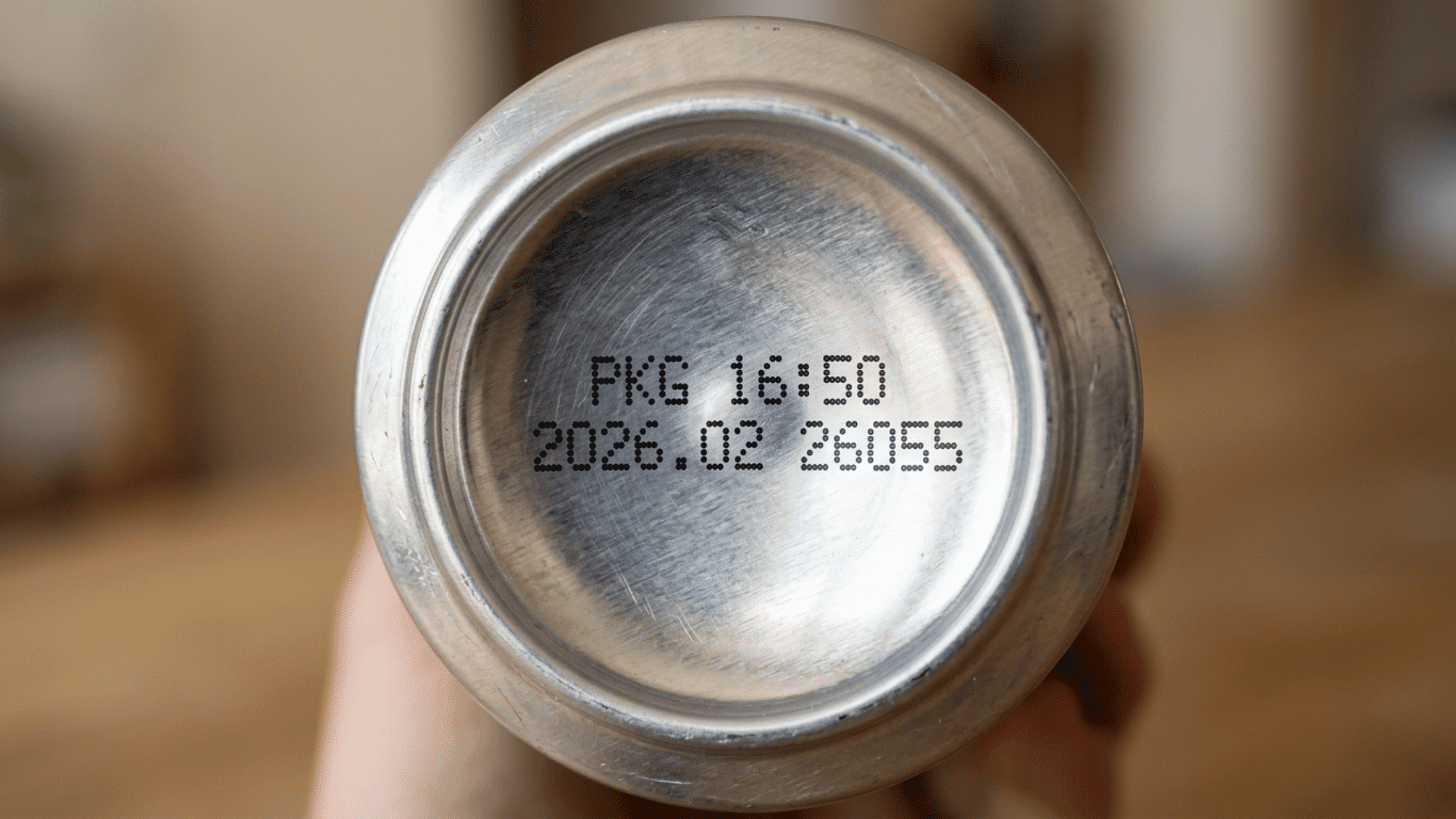 bottom of a beer can displaying packaged-on time, date, and Julian date code